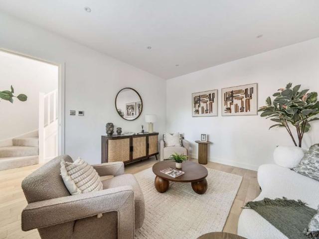 Exceptional four bedroom home with luxury finishes, south facing garden and parking for two