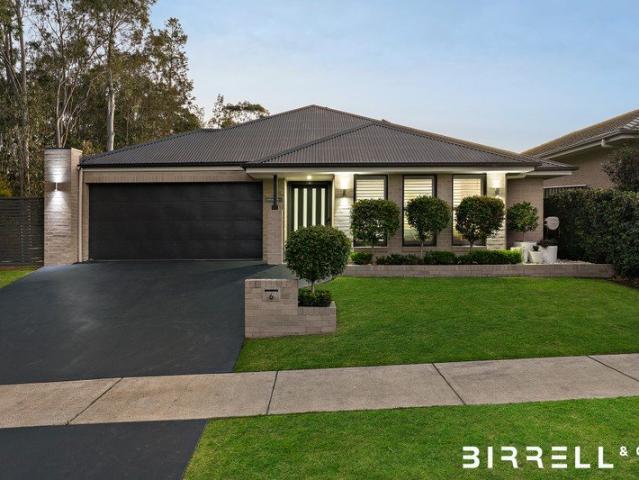 Exceptional McDonald Jones Family Living on Approximately 649sqm, Privately Positioned at the End of a Peaceful Cul de Sac with Bushland Outlook