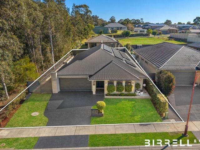 Exceptional McDonald Jones Family Living on Approximately 649sqm, Privately Positioned at the End of a Peaceful Cul de Sac with Bushland Outlook