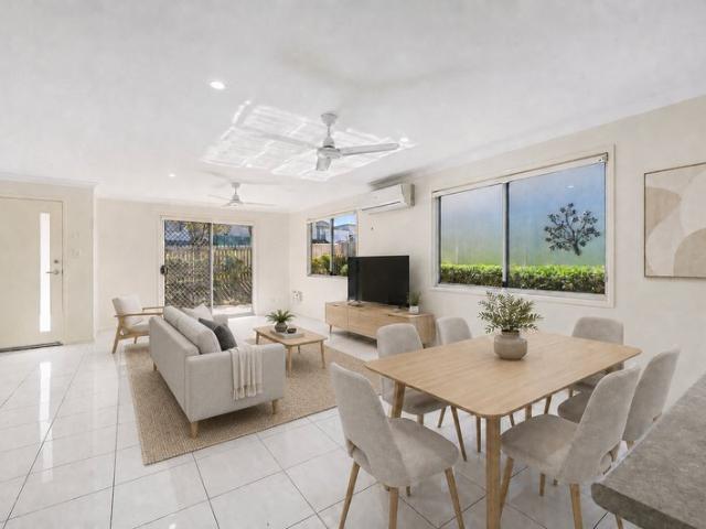 Exceptional Modern Duplex Offering Privacy, Style & Convenience!