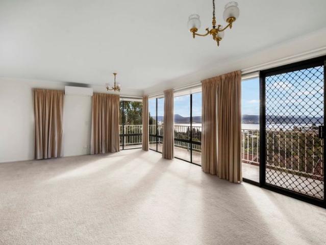 Exceptional River Views & Flexible Living in a Prime Sandy Bay Location