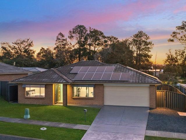 Exceptional single level family home with side access