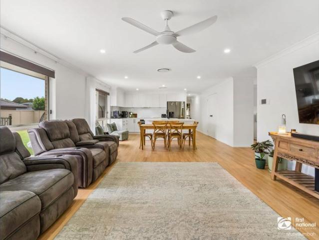 Exceptional Single Level Living with a Stunning Poolside Entertaining Area