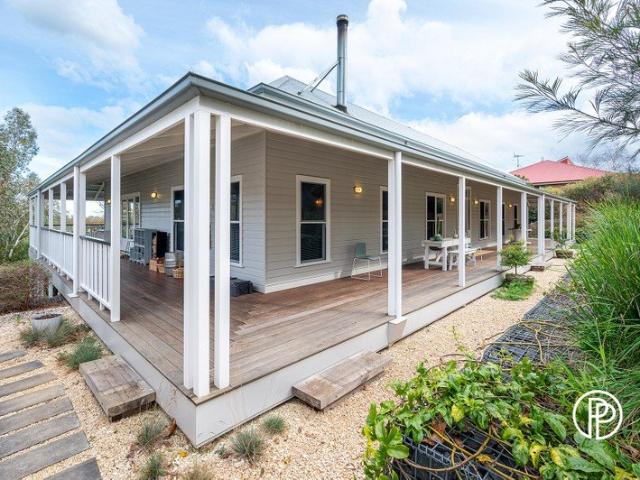 EXCEPTIONALLY BUILT HOME PICTURE PERFECT SETTING