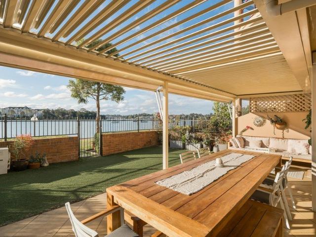 Exceptionally Rare Ground Floor Waterfront Residence with North Facing Courtyard