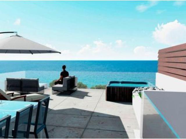 EXCLUSIVOS APARTAMENTOS EN PLANTA BAJA DE OBRA NUEVA EN ISLA PLANA FRENTE AL MAR