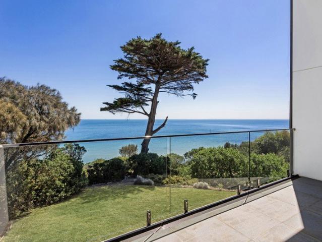 Exclusive clifftop retreat with direct beachfront access