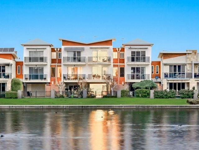 Exclusive Lakeside Living with Spectacular Panoramic Water Views!