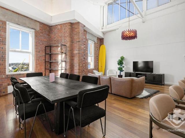 Exclusive Top Floor Woolstore Living with River Views