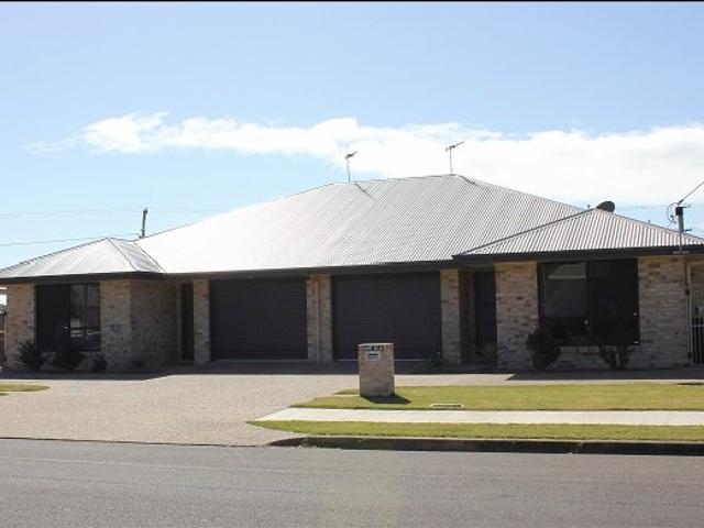 Executive 2 bedroom unit in a great location with high clearance powered shed