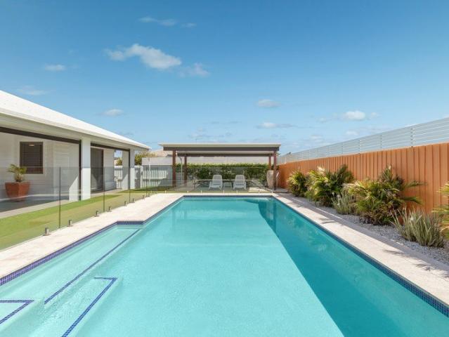 Executive Single Level Coastal Living with Rare 4 Car Garage