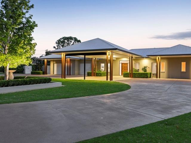 Executive Quality Resort Like Home with Large Sheds on 9 Acres!