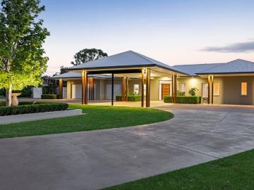 Executive Quality Resort Like Home with Large Sheds on 9 Acres!