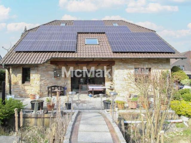 Exklusives EFH mit Bruchsteinfassade, Fußbodenheizung, Carport und PV Anlage in Rheda