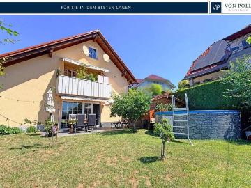 Exklusives Einfamilienhaus mit Einliegerwohnung und idyllischer Gartenoase in begehrter Wohnlage