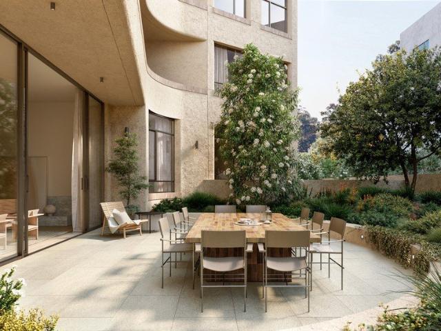 Expansive courtyard living, framed by garden