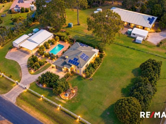 Expansive Corner Block Acreage Living in a Convenient Location