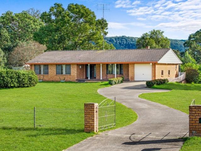 Expansive Acreage Living with Endless Potential in Regentville!