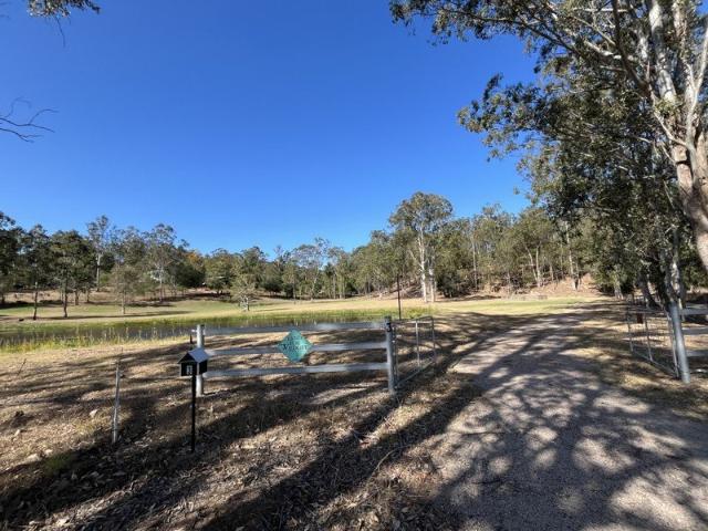 EXPANSIVE ACREAGE LIVING WITH POOL, MULTIPLE LIVING AREAS AND RURAL VIEWS