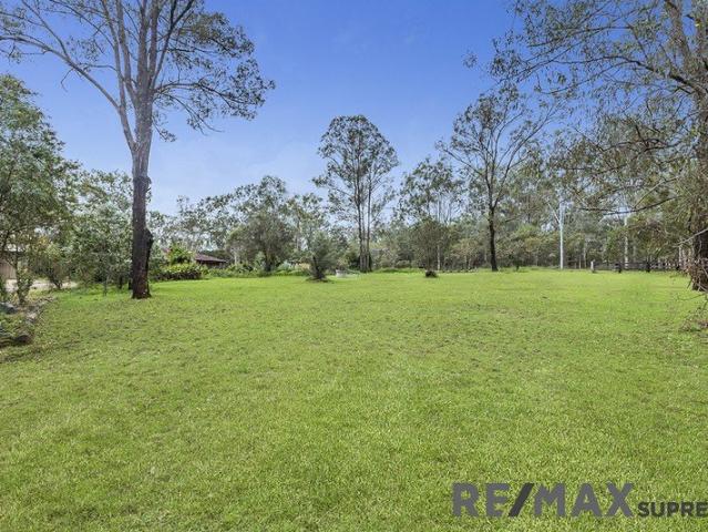 EXPANSIVE ACREAGE PROPERTY WITH HORSE KEEPING POTENTIAL& POOL