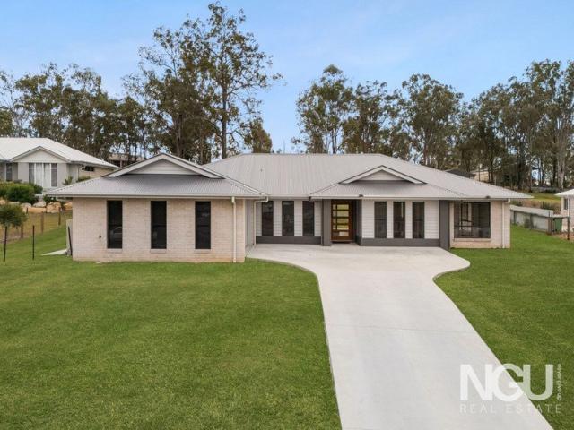 Expansive Acreage Residence only Minutes from Amenities with Room for Pool and Shed!