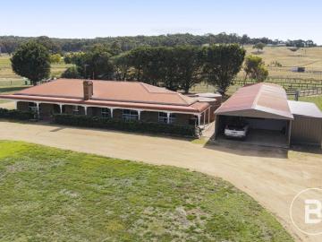 EXPANSIVE ACREAGE RETREAT WITH MODERN COMFORTS & FARM/HORSE INFRASTRUCTURE