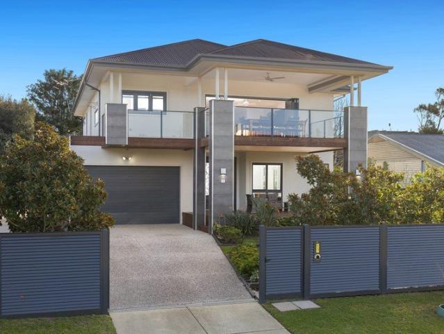 Expansive Beachside Family Living with Creek and Bay Outlooks