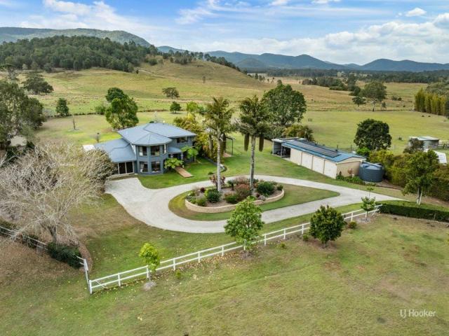 Expansive Elevated Acreage Living with Space, Privacy & Rural Views
