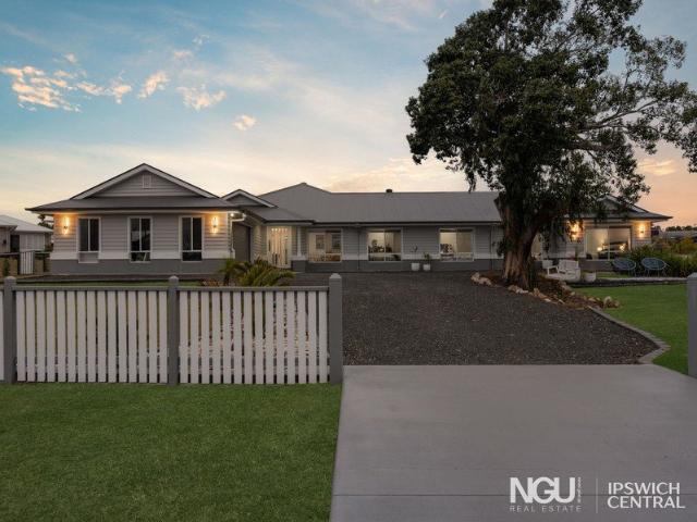 EXPANSIVE FAMILY HOME WITH MULTIPLE LIVING AREAS, SHED & CARPORT
