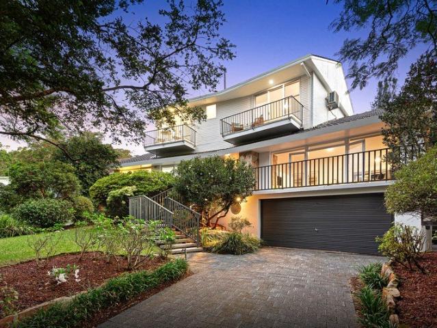 Expansive Family Home with Private Backyard in a Peaceful Middle Cove Setting