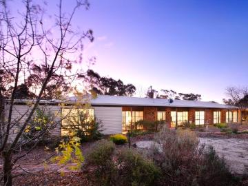 Expansive family living with breathtaking views 1 acre setting in town