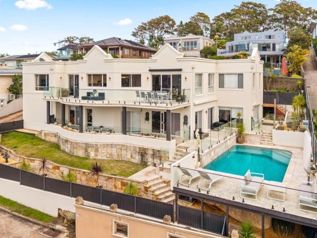 Expansive Family Living with Sweeping Water Views and Deep Waterfront Facilities