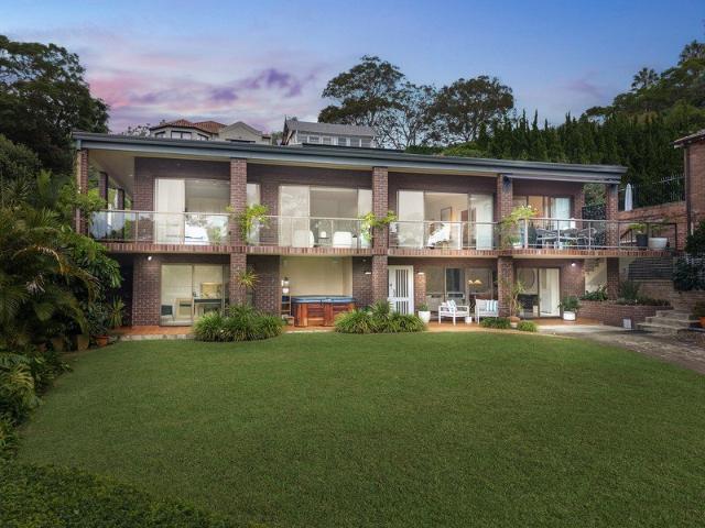 Expansive Family Residence with Sweeping Water Views in Sought After Peninsula Setting