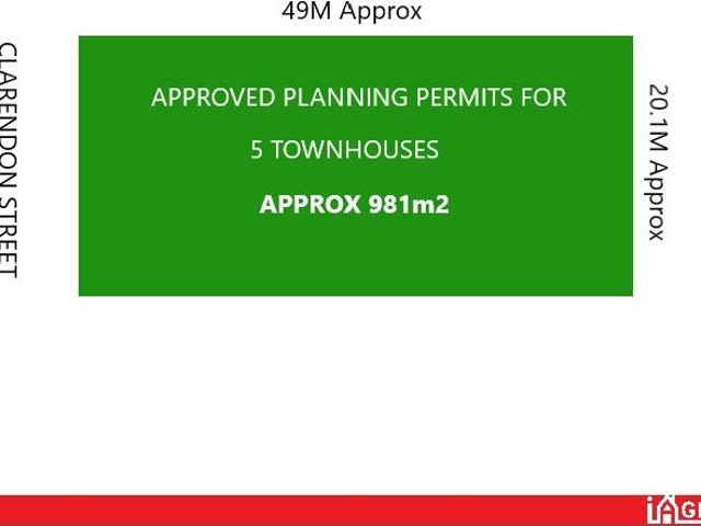 EXPANSIVE LAND WITH 5 TOWNHOUSE PERMITS!