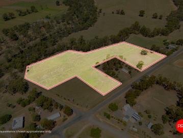 Expansive Lifestyle Acreage with River Backdrop