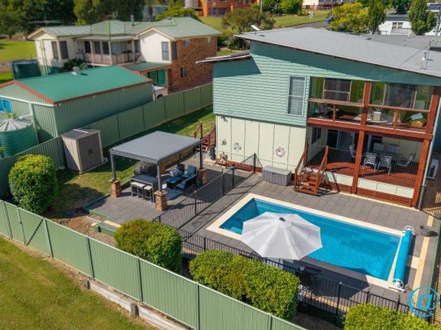 Expansive, Stylish Home with Pool. Deceptive from the outside!