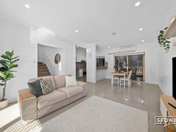 Expansive Townhouse Living with Multiple Outdoor Spaces in Peaceful Setting