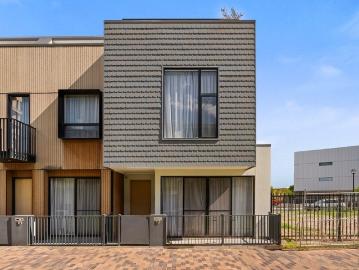 Experience modern living with the water and local cafes only moments away