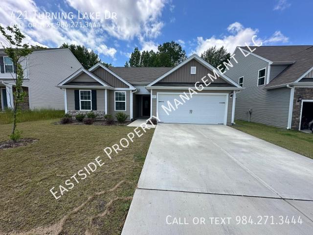 Experience easy, modern living in this beautifully maintained 3 bed, 2 bath, 2 car garage single story ranch nestled in one of Zebulon's most welcoming communities!