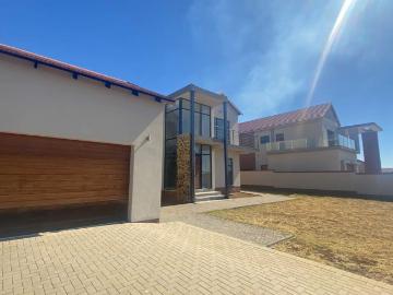 Experience luxury living in this newly built 4 bedroom home, situated in the prestigious Wild Olive