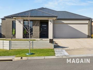 Experience versatile family living in a chic, modern oasis