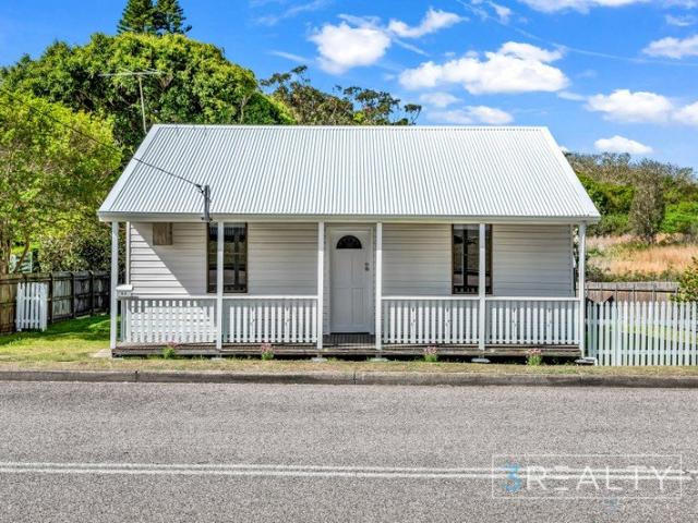 Explore the charm of this thoughtfully renovated miners cottage on the historic Flowers Drive