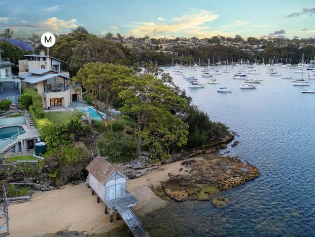 Exquisite waterfront home with city vistas