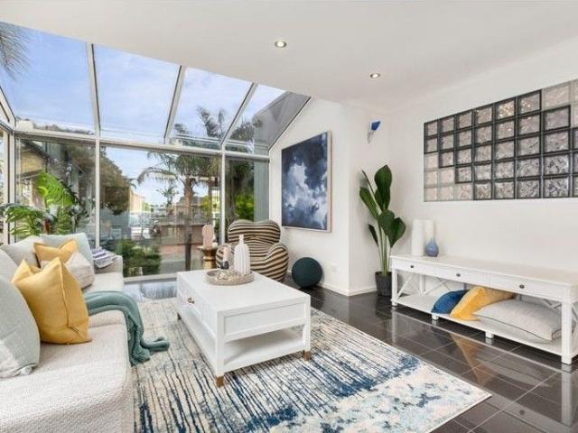 Exquisite Waterfront Living in Prestigious Patterson Lakes