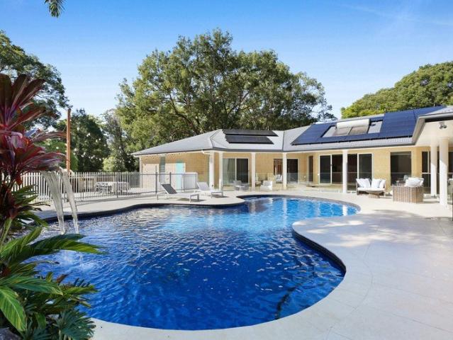 Exquisitely Renovated, Tranquil Acreage Oasis with Dual Living