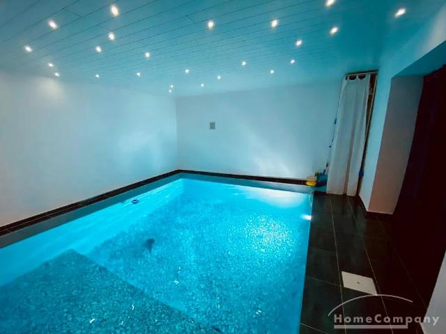 Extraordinary Designer Bungalow with Indoor Pool, Home Cinema & Smart Home in a Quiet Natural Setting