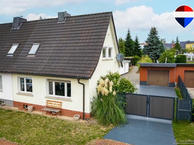 Familienfreundliche DHH mit modernisiertem Wohnkomfort, Garage und großzügigem Grundstück