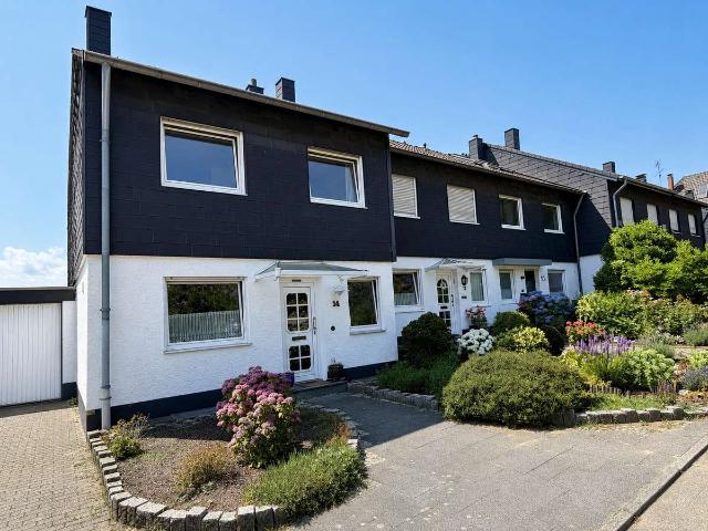 Familienglück in Heiligenhaus: Gepflegtes Reihenendhaus mit Garten und Kamin