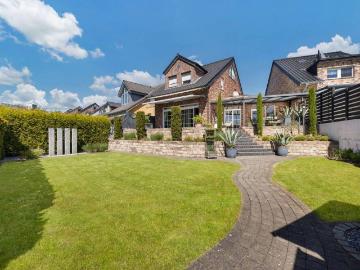 Familienparadies Traumhaftes Einfamilienhaus mit wunderschönem Garten & sonniger Terrasse