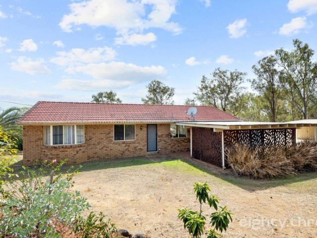 Family Friendly Acreage Living in the Heart of Regency Downs